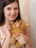 Lima strips and plays with her favorite stuffed toy