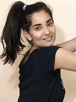 Emily Rose posing nude on the couch